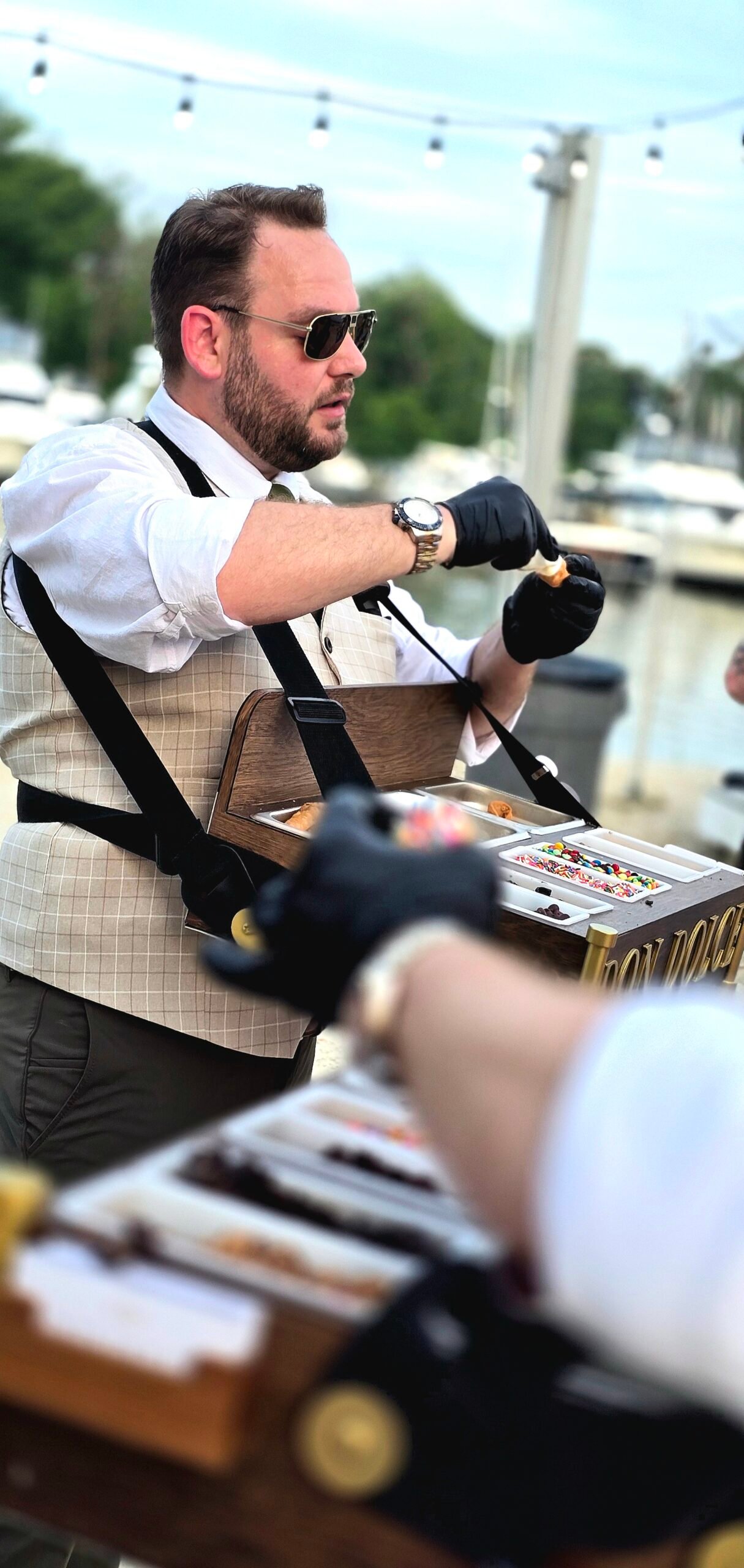 Don Dolce roaming cannoli service for wedding guests at Safe Harbor Great Oak Landing on Fairlee Creek in Chestertown, Maryland