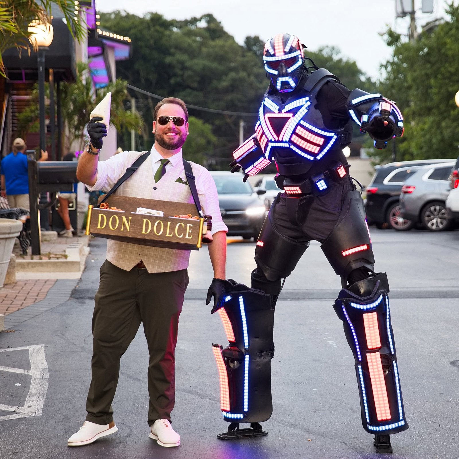 Don Dolce posing with an illuminated LED robot performer outside Chesapeake Inn in Chesapeake City, Maryland.